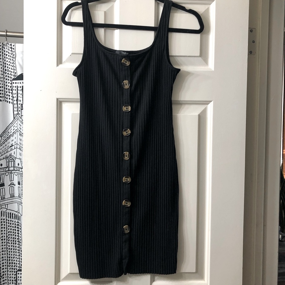 Black dress with tortoise buttons